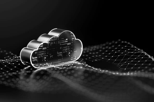 A glowing cloud icon over a networked digital landscape, representing cloud computing or data infrastructure.
