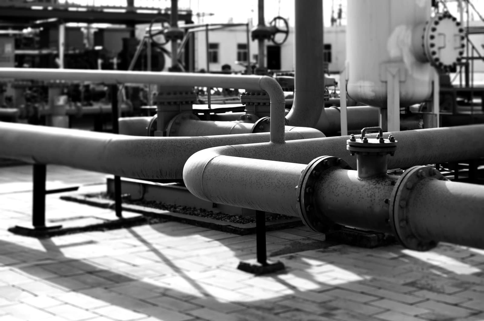 Close up of pipelines and valves outside of a factory
