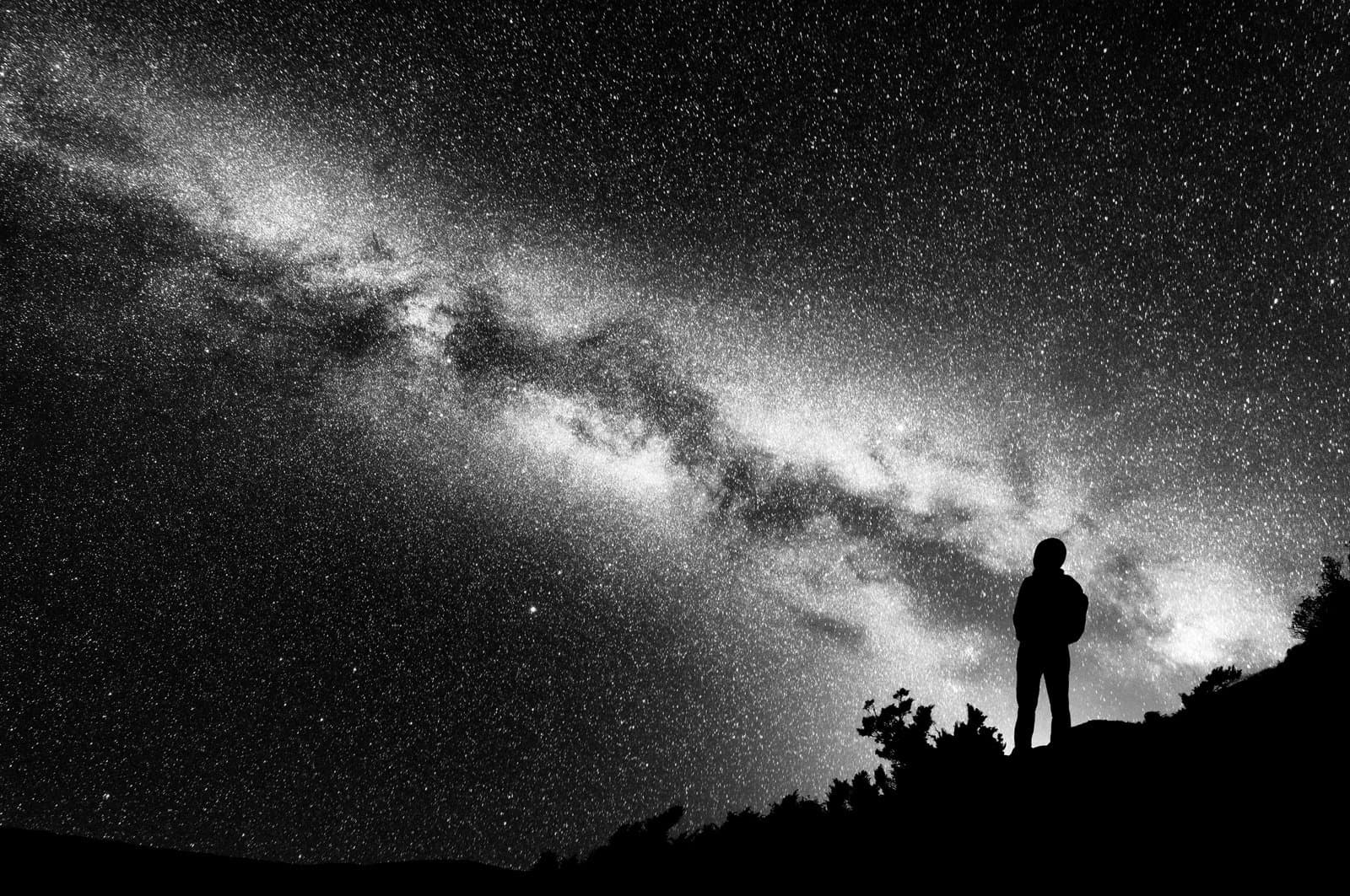 Silhouette looking at the night sky