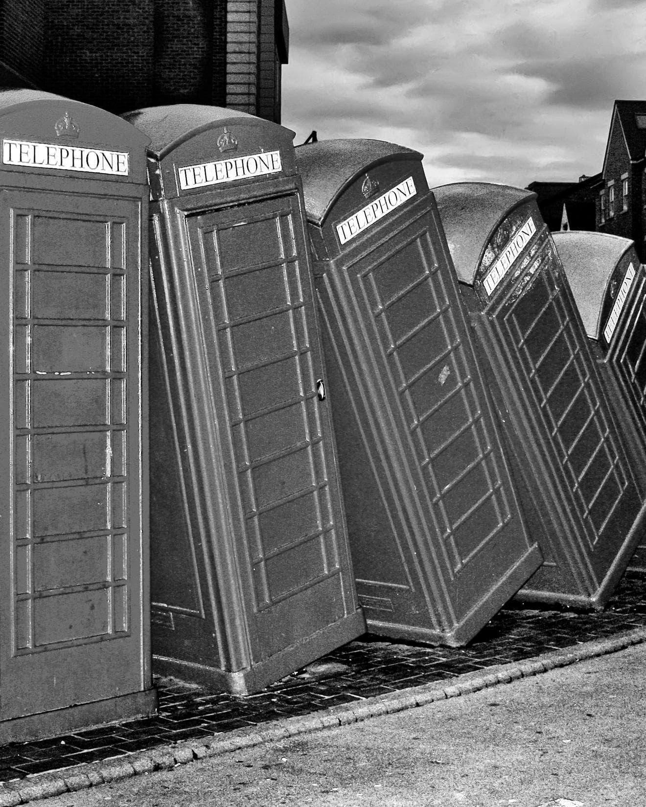 Stack of tumbling telephone boxes