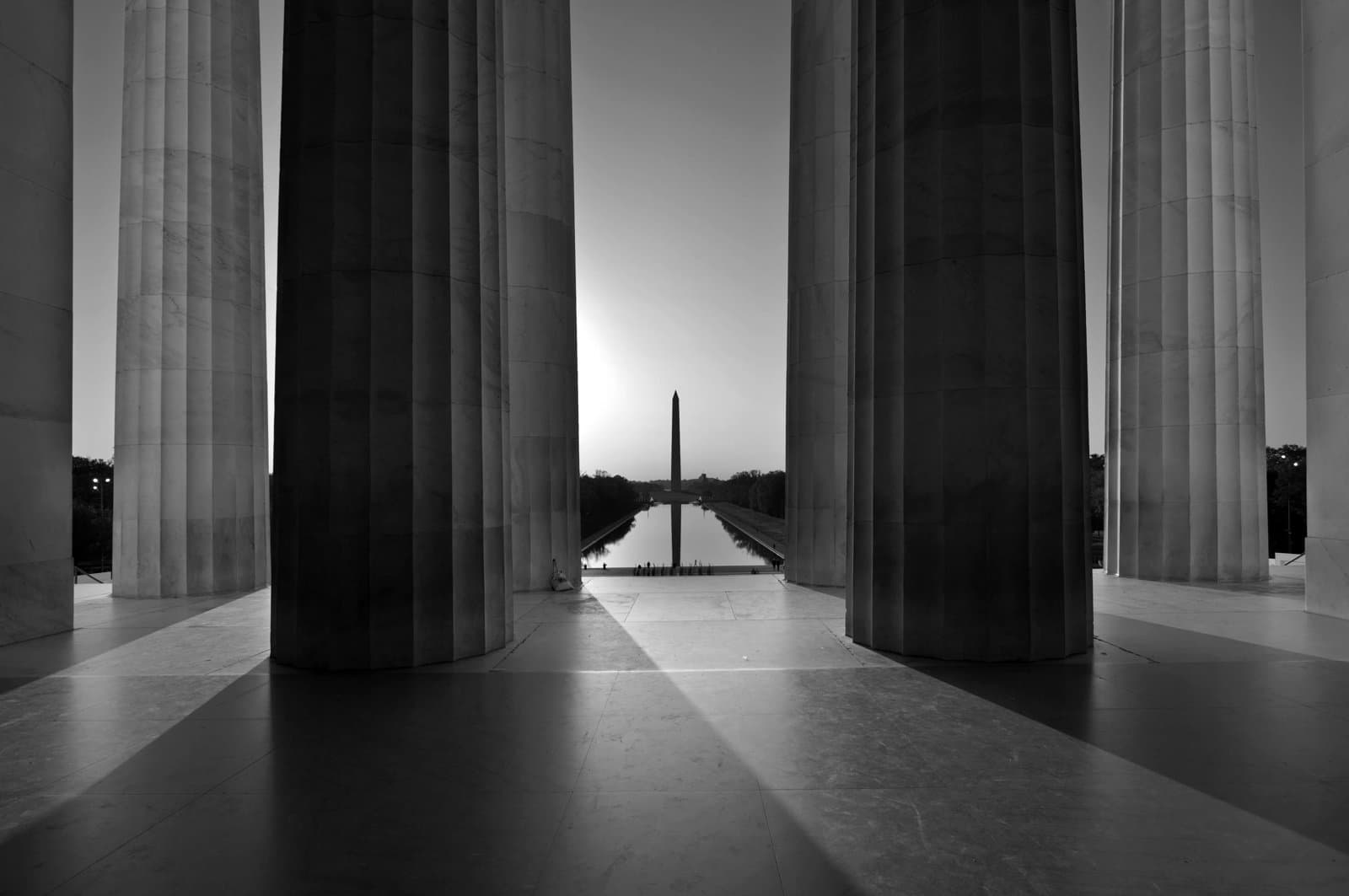 Sunrise scene of the Washington Monument viewed from the Lincoln Memorial of Washington DC, USA.